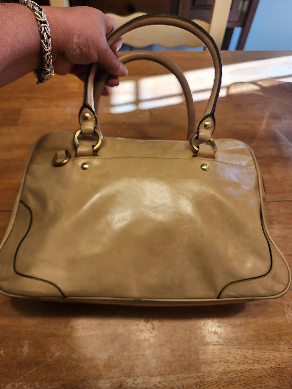 2011 Coach Poppy Push Lock Satchel features a beige leather exterior